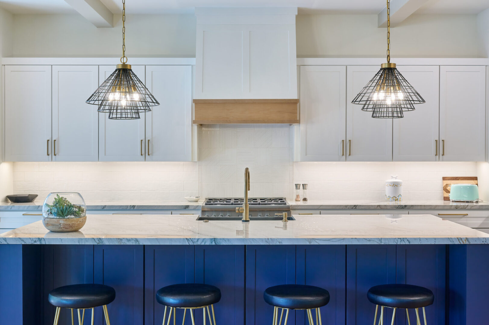 Blue and white kitchen with ceiling lamps